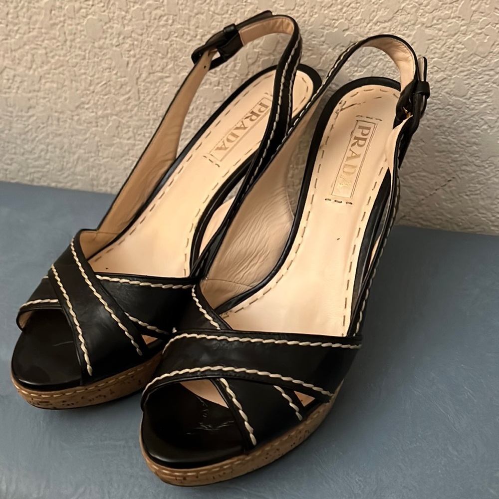Prada strapped heels in classic black.